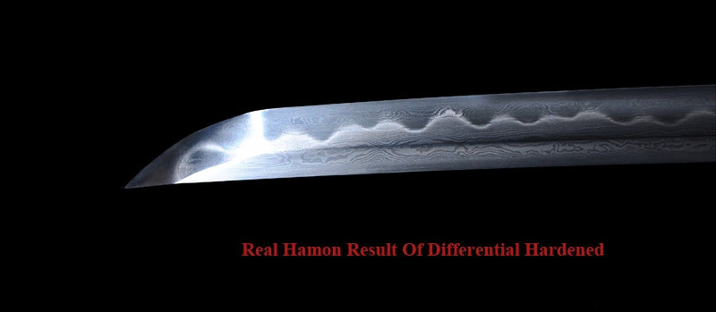 Close up view of nie and nioi activity inside a real katana hamon
